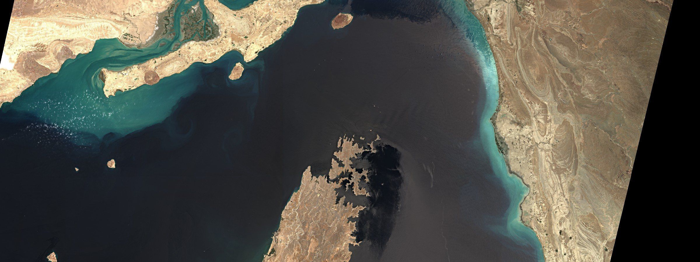 Sentinel-2 L2A surface reflectance, bands B04/B03/B02. The Strait of Hormuz, between the Arabian Gulf and the Gulf of Oman, 6 July 2026. Dissolved oxygen is invisible from orbit, so nothing in the frame shows the loss the issue describes, at the surface or at depth.