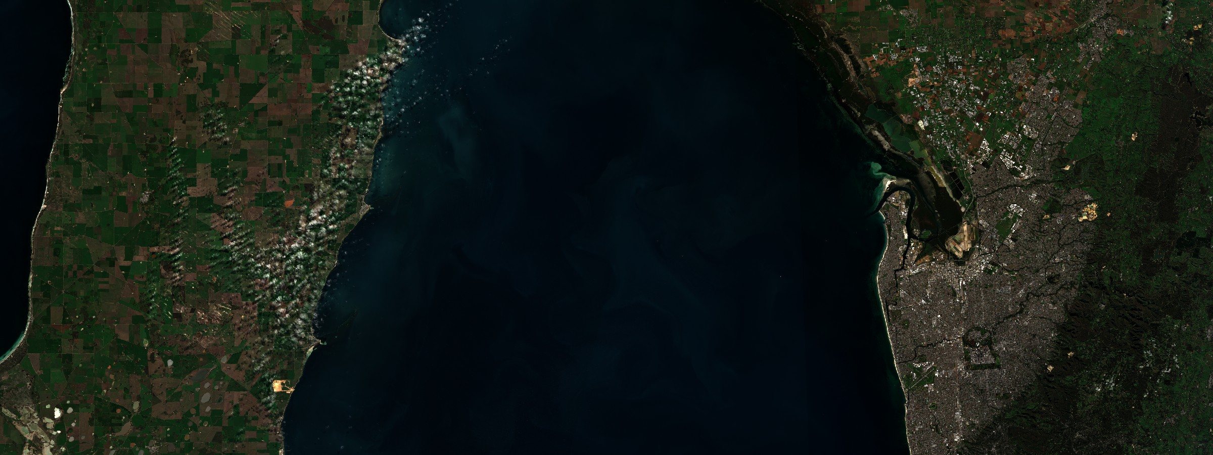 Sentinel-2 L2A surface reflectance, bands B04/B03/B02. Gulf St Vincent, South Australia, 27 June 2026. No bloom is visible because by this date there was not one. Nothing in the frame measures a fish stock, and the image settles neither of the two readings the piece sets against each other.