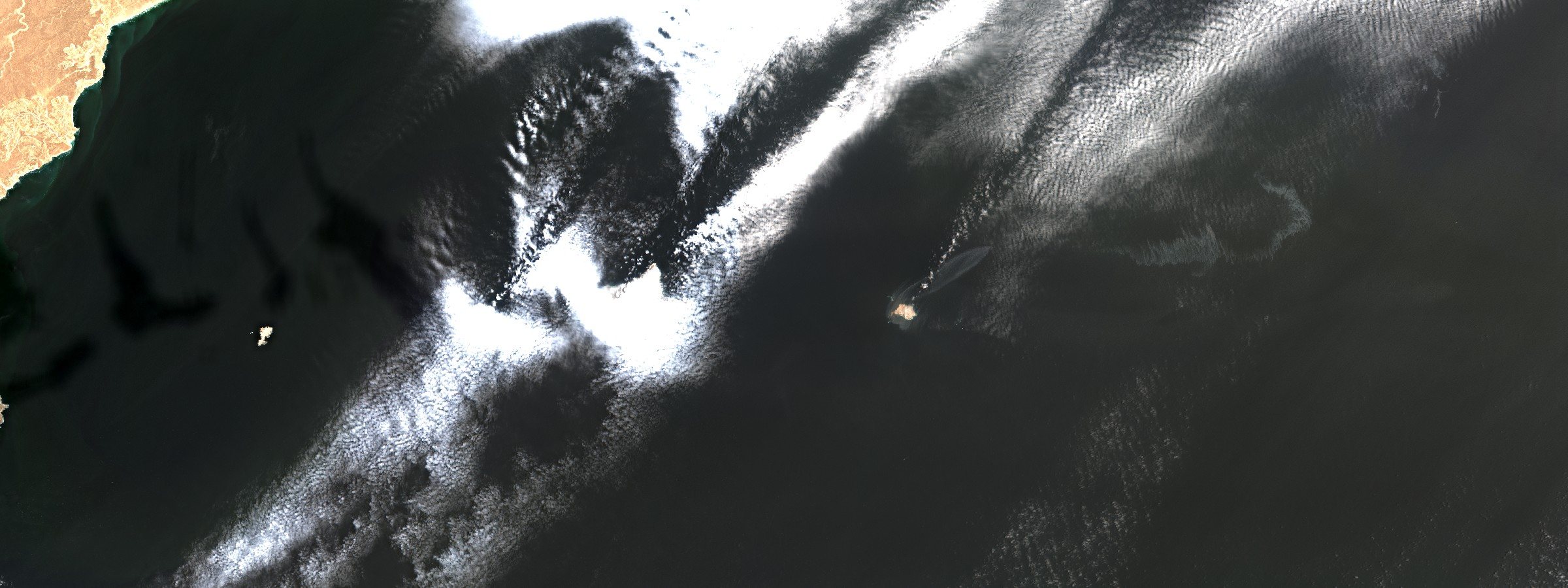Sentinel-2 L2A surface reflectance, bands B04/B03/B02. The Hallaniyat Islands, Oman, 14 August 2026. The vessel is not resolvable at ten metres and is not identified here. No slick is delineated, and the reserve's boundary - whose annex was never published - is not drawn.